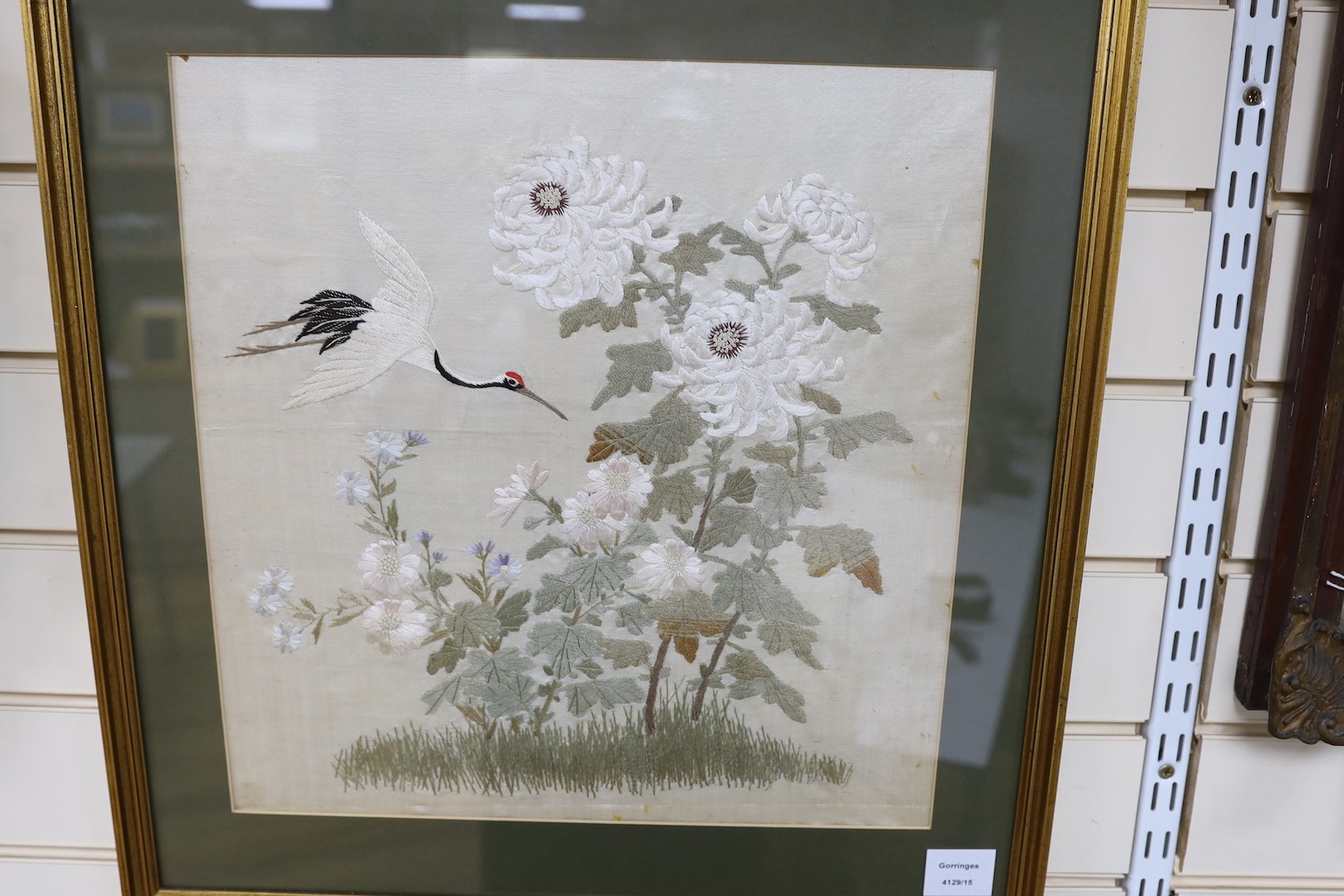 A pair of late 19th century Japanese silk work panels of heron amongst foliage - 41.5 x 41cm
